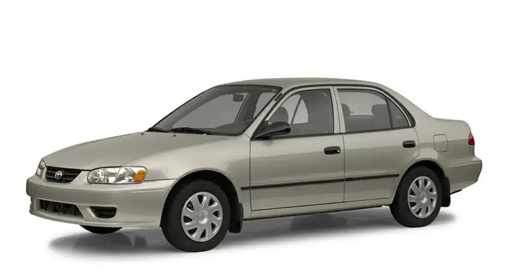 Silver 2000s sedan with smooth lines and compact design, viewed from the side.