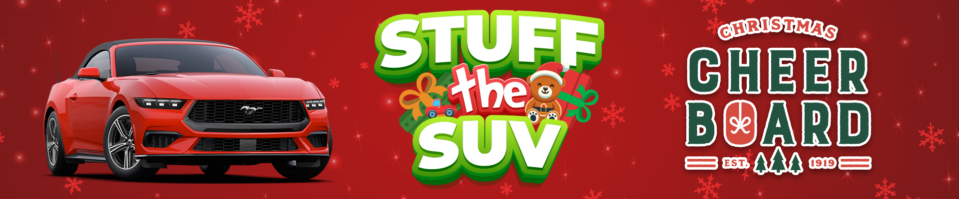 Red sports car with "Stuff the SUV" and "Christmas Cheer Board" text, festive holiday theme.
