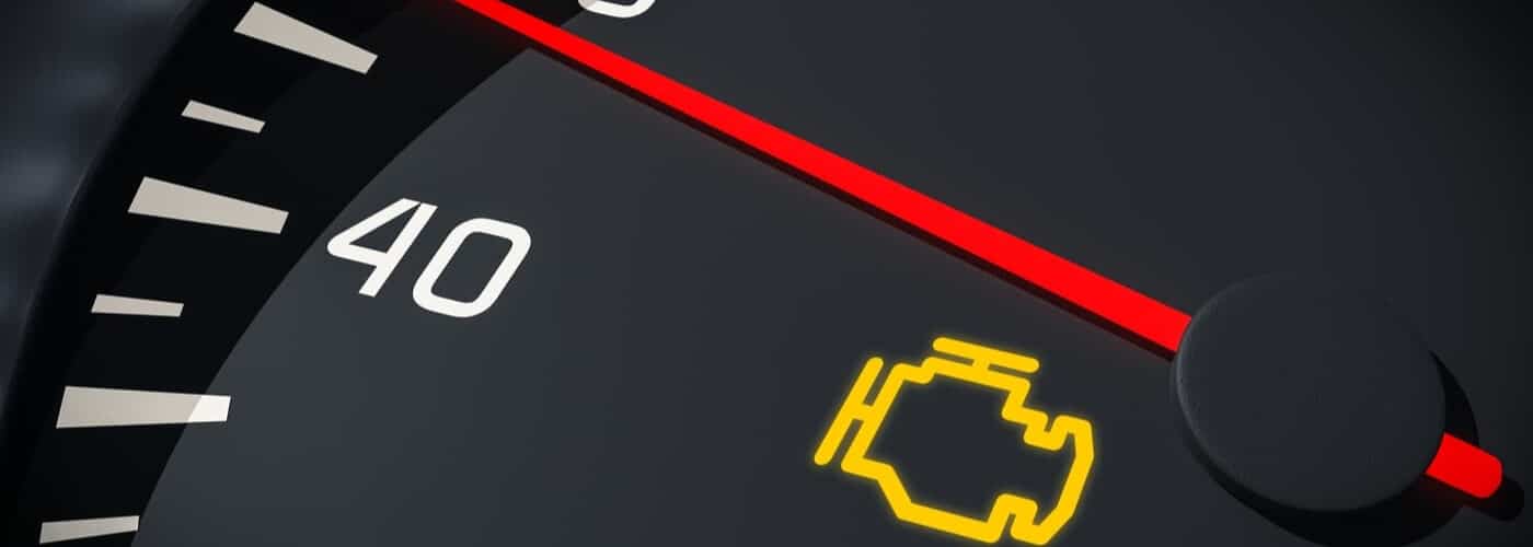 Speedometer displaying 40 with a lit yellow check engine icon indicating a potential car issue.
