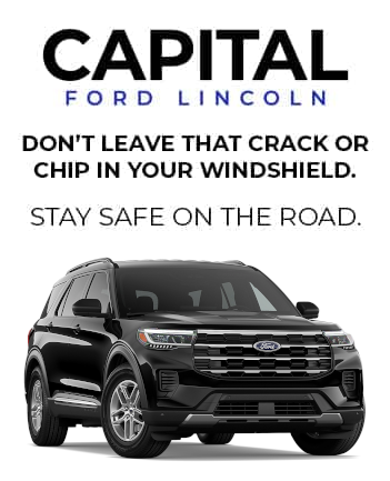 Black Ford SUV with text: "Don't leave that crack or chip in your windshield. Stay safe on the road."